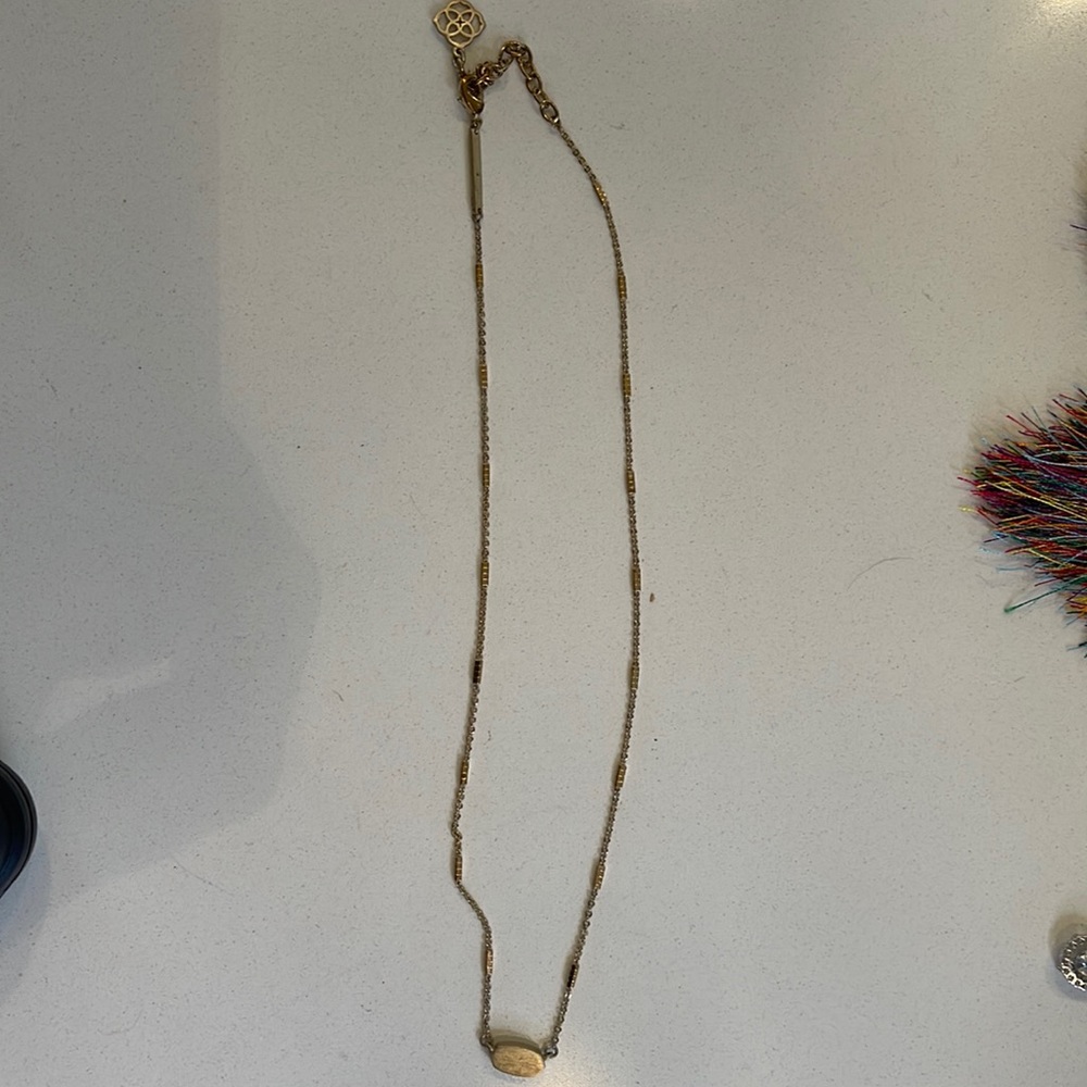 Kendra scott gold necklace. Needs some TLC bc it is a bit tarnished .